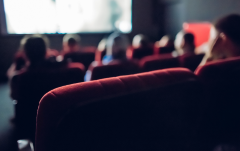 crowd sitting in a movie theatre