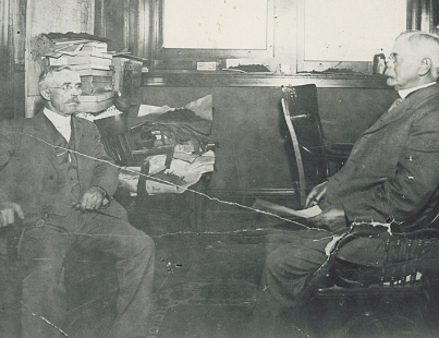 John Pinkerton discussing daily operations with his factory manager in Toledo